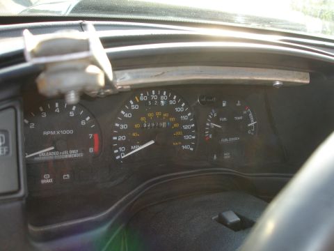 1993 Ford Taurus - Interior view of a 1993 Ford Taurus dashboard, displaying odometer, tachometer, fuel, and temperature gauges.