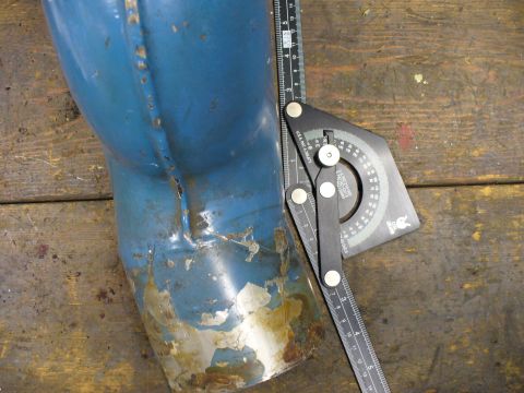 1978 Ford Bronco - A blue exhaust pipe is shown with a measuring tool, indicating a part rather than a complete vehicle.