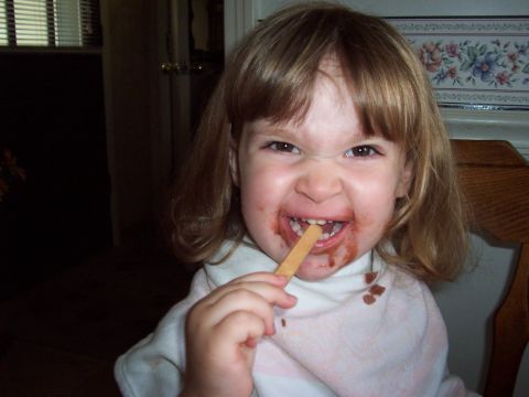 2000 Ford Crown Victoria - Child makes a funny face while eating a chocolate popsicle.