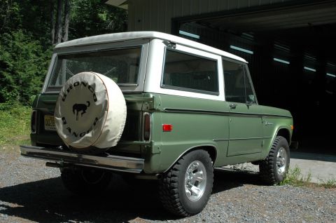 1973 Ford Bronco - Rear view of a 1973 Ford Bronco, showing its distinctive body style and spare tire.