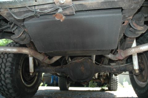 1973 Ford Bronco - Underside view of a 1973 Ford Bronco, highlighting its dual exhaust system and fuel tank.