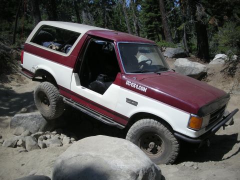 1991 Ford Bronco - This 1991 Ford Bronco navigates a rocky trail with its doors removed.