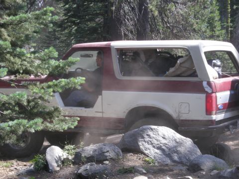 1991 Ford Bronco - This 1991 Ford Bronco navigates a rocky path through a wooded area.