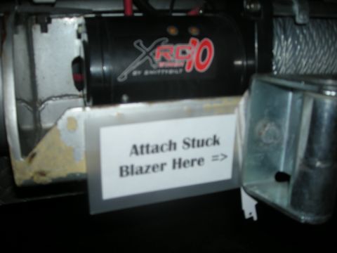 1991 Ford Bronco - A winch assembly is shown with a sign indicating where to attach a stuck Blazer.
