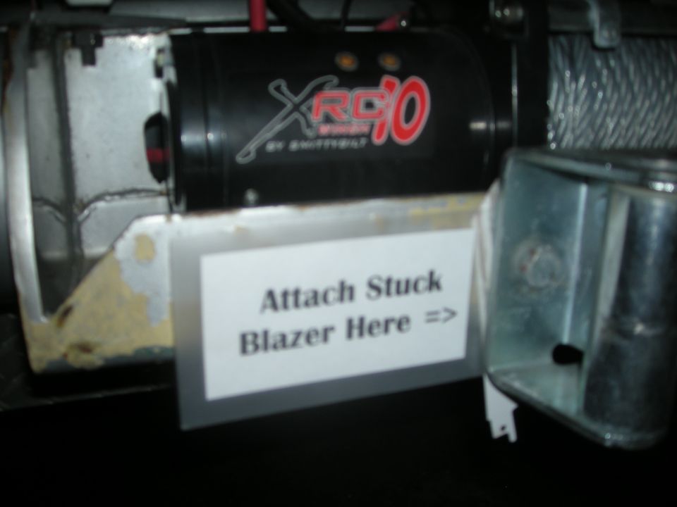 Winch with XRC10 logo and a sign reading 'Attach Stuck Blazer Here =>'