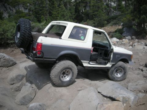 1991 Ford Bronco - This 1991 Ford Bronco navigates a rocky trail with its doors removed.