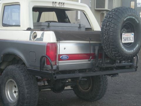 1991 Ford Bronco - This Ford Bronco has a spare tire mounted on the rear bumper and a California license plate.