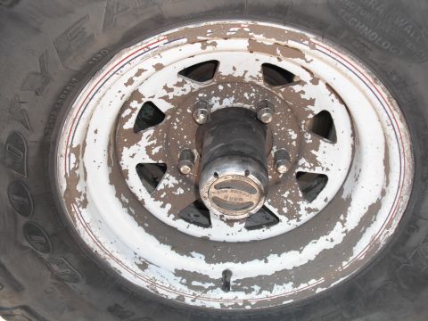 1991 Ford Bronco - This is a close-up of a wheel and tire assembly, a WARN locking hub.