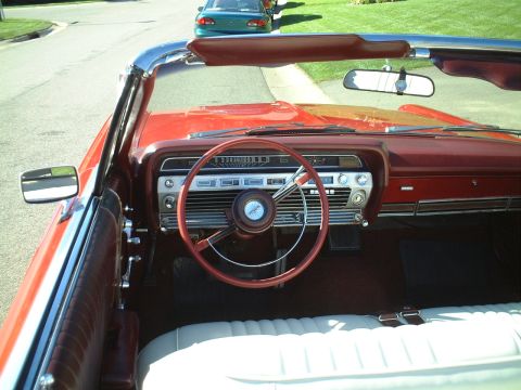 1967 Ford Galaxie - Interior view of a 1967 Ford Galaxie convertible, showing the dashboard and seats.