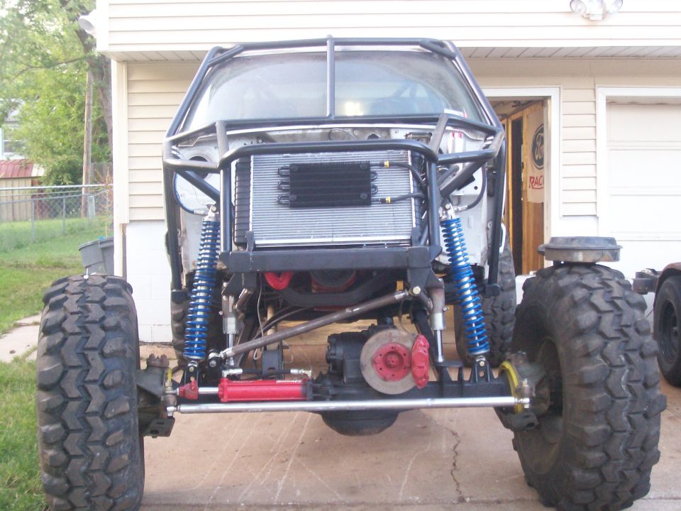Buggy build with large tires, roll cage, and external radiator