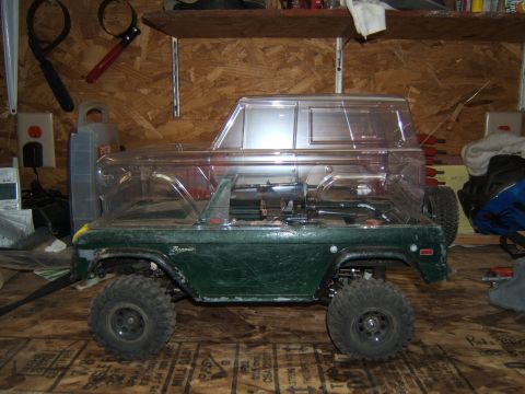 1988 Ford Bronco - This RC car features a green body with a clear shell, resembling a classic SUV.