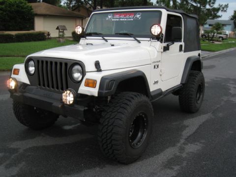 1985 Ford Bronco - This Jeep Wrangler TJ has been modified with off-road tires and auxiliary lighting.