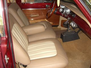 1964 Ford Falcon - Interior view of a car showing seats, dashboard, and door panel details.