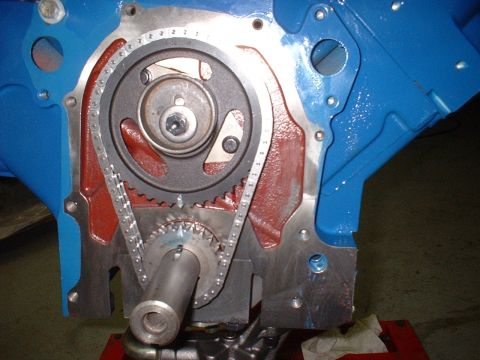 1968 Ford Galaxie - Close-up of an engine's timing chain and gears, with a blue painted block and red accents.