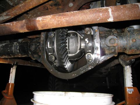 1996 Ford Bronco - Close-up view of an open differential, revealing the internal gears and markings on the cover.