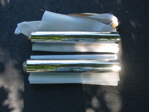 2003 Mercury Marauder - Two new chrome exhaust tips are shown, packaged for protection.