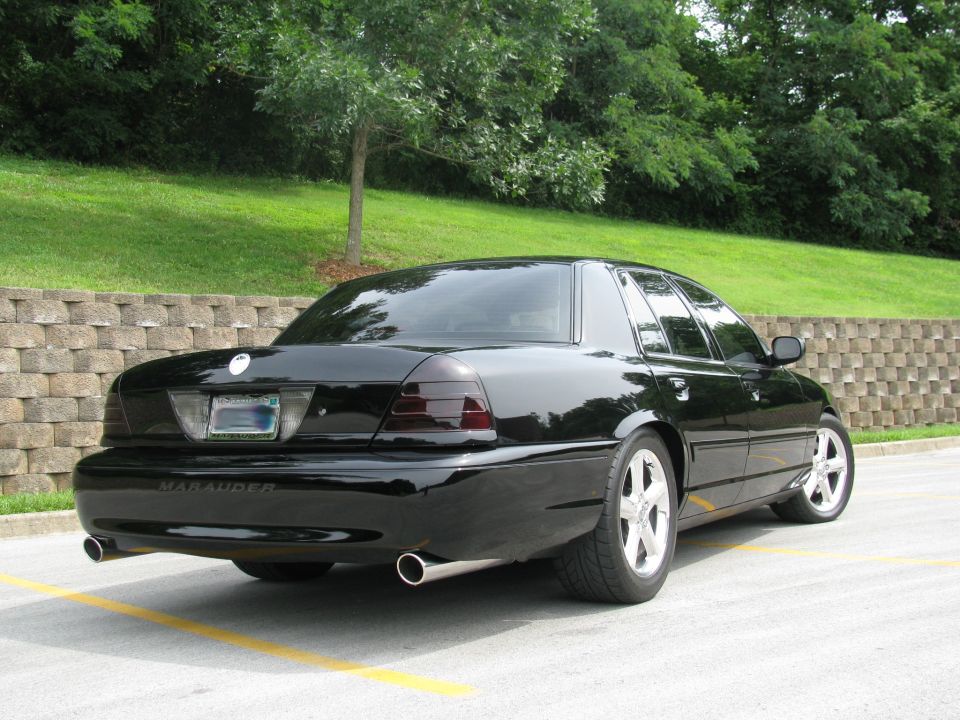 2003 Mercury Marauder rear view, black paint, tinted taillights, dual exhaust tips