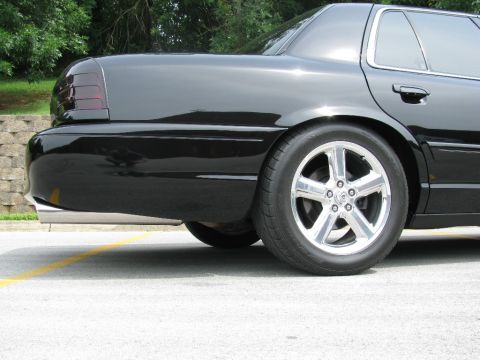 2003 Mercury Marauder - Rear view of a black 2003 Mercury Marauder showing its distinctive taillights and chrome exhaust.