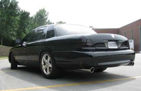 2003 Mercury Marauder - The rear of a black 2003 Mercury Marauder is shown, tinted taillights and dual exhaust pipes.