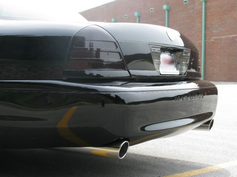 2003 Mercury Marauder - Rear view of a black 2003 Mercury Marauder, showing its distinctive taillights and dual exhaust.