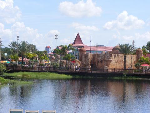2008 Jeep Cherokee - A scenic view of resort architecture and water features with palm trees.