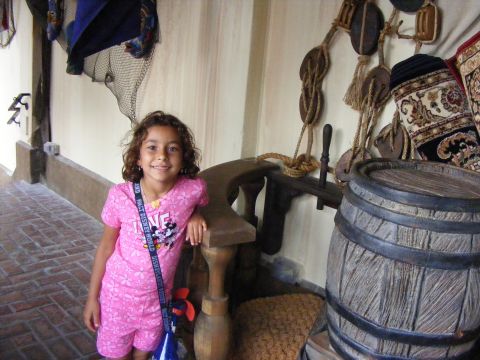 2008 Jeep Cherokee - A young girl poses for a photo in front of a barrel and decorative ropes, possibly at a themed attraction.