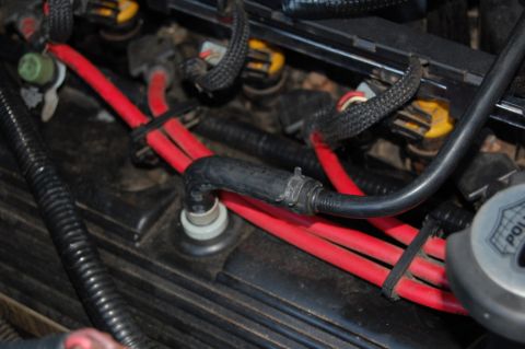 1985 Mercury Grand Marquis - Engine bay wiring and hoses are visible in this close-up shot.