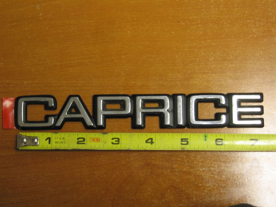 Caprice emblem with a tape measure underneath