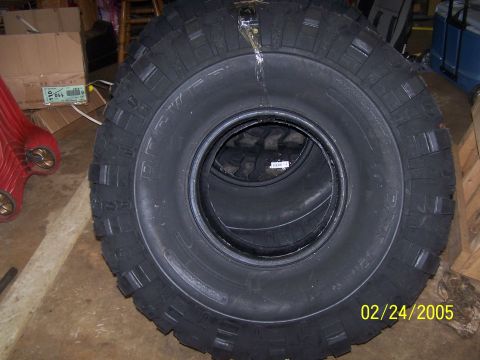 1979 Ford F-150 - Several large tires are stacked indoors, with a date stamp visible in the corner.