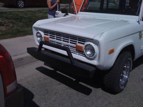 1995 Ford Bronco - This classic Ford Bronco features a heavy-duty bull bar, a distinctive grille, and round headlights.