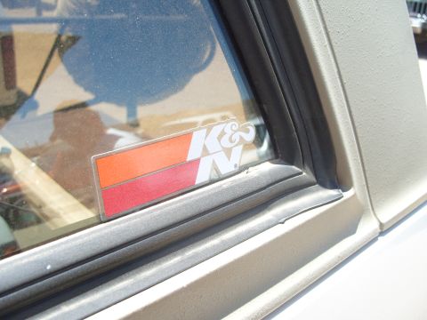 1995 Ford Bronco - Close-up of a K&N sticker applied to the window of a vehicle.