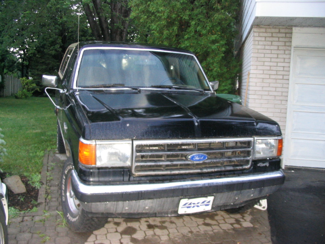 Black 1986 Ford Bronco front view with chrome grille and Ford emblem