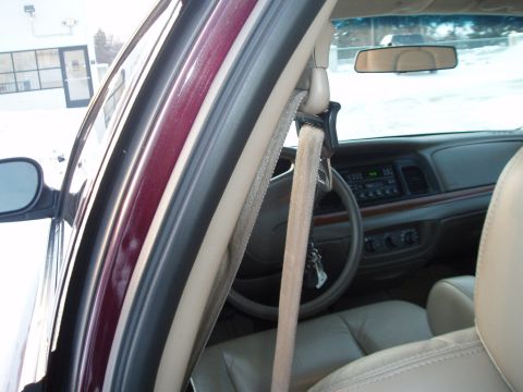 1999 Ford Crown Victoria - Interior view of a 1999 Ford Crown Victoria, showing the dashboard, steering wheel, and seating.