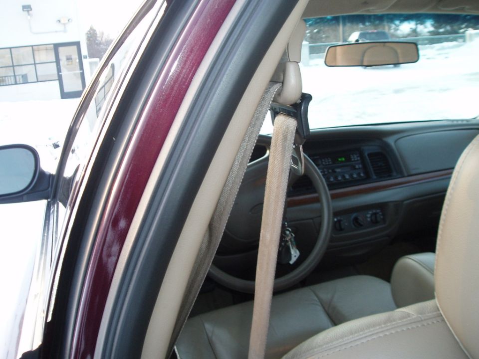 1999 Ford Crown Victoria interior, beige seats, steering wheel, dashboard