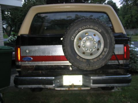 1986 Ford Bronco - This Ford Bronco has a two-tone paint scheme and a rear-mounted spare tire.