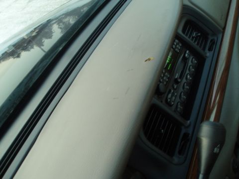 1999 Ford Crown Victoria - Interior view of a 1999 Ford Crown Victoria, focusing on the dashboard and center console.