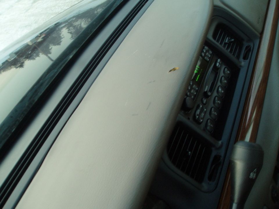 1999 Ford Crown Victoria interior showing dashboard, radio, and gear shifter