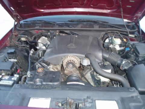 1999 Ford Crown Victoria - The engine bay of a maroon 1998 Ford Crown Victoria is visible with the hood open.