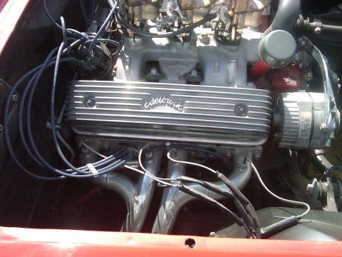 1988 Ford Bronco - Engine bay details aftermarket Edelbrock valve covers and chrome exhaust headers.