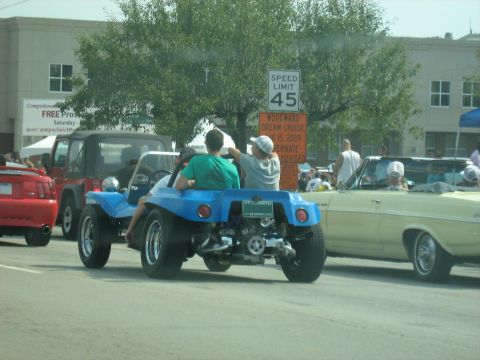 1988 Mercury Grand Marquis - A blue dune buggy drives down the street during the Woodward Dream Cruise in 2009.