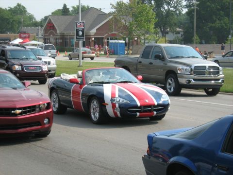 1988 Mercury Grand Marquis - A convertible sports car is seen with a Union Jack livery during a cruise event.