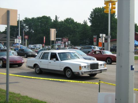 1988 Mercury Grand Marquis - White 1988 Mercury Grand Marquis in traffic on a sunny day.