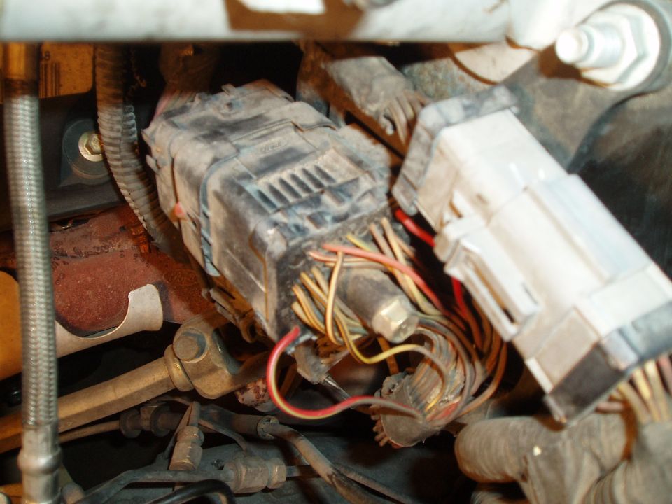cut the red/green wire, a few inches away from the connector, on that side (towards fender)


run the red wire from tach adapter to the side of the wire going down into the engine harness.
run the red/light green wire from tach adapter to the side of wire going into that connector.