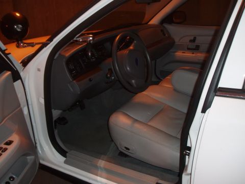 2003 Ford Crown Victoria - View of the car's interior, focusing on the seats and dashboard area.
