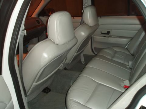 2003 Ford Crown Victoria - Interior view of a car, showing the back seats and door panels.