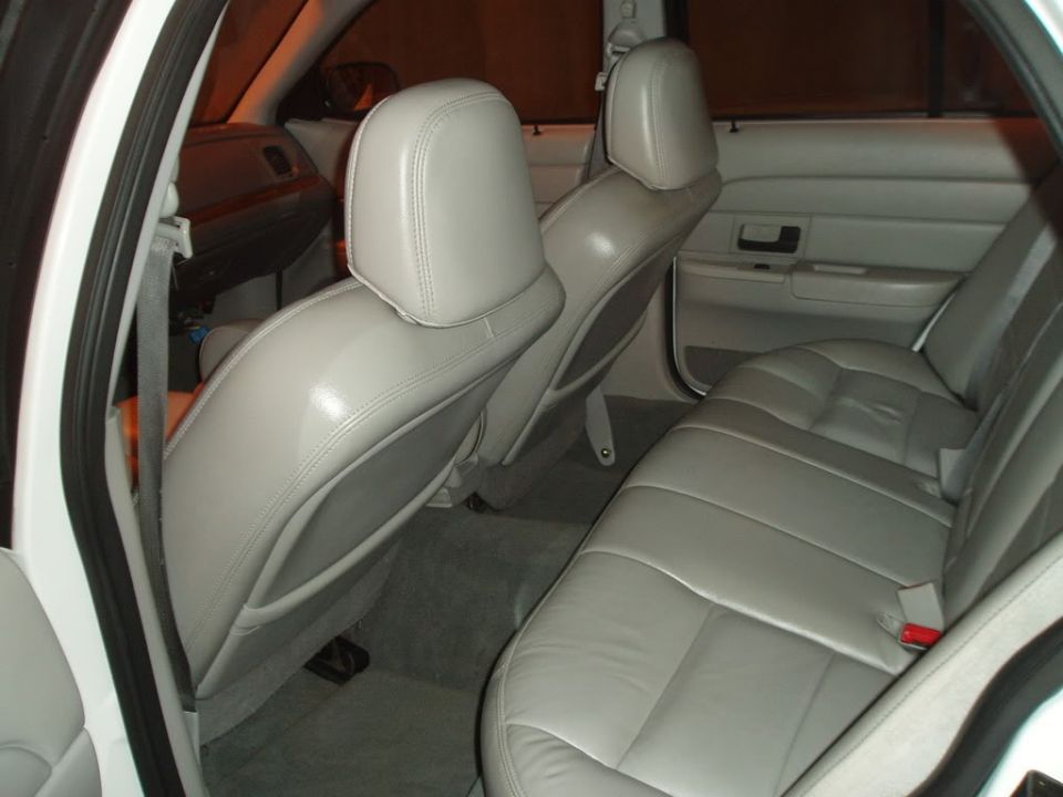 Car interior with light-colored seats and door panels