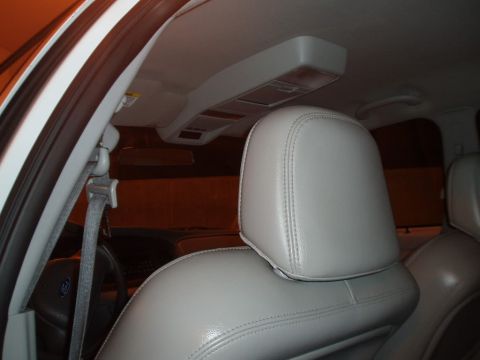 2003 Ford Crown Victoria - Close-up view of a car's interior, focusing on the headrest and seat.
