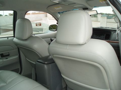 2003 Ford Crown Victoria - Interior view of a 2003 Ford Crown Victoria, showing the front and rear seats.