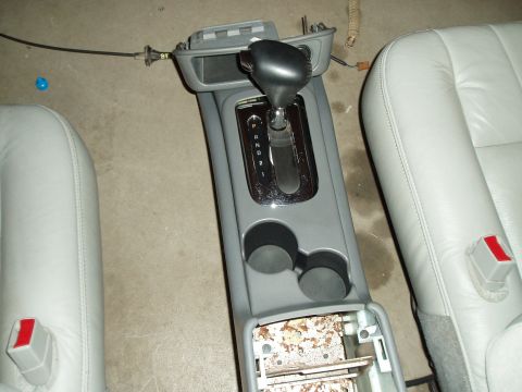 2003 Ford Crown Victoria - Center console and gear shifter from a car interior, showing the P-R-N-D-1-2 gear selection.