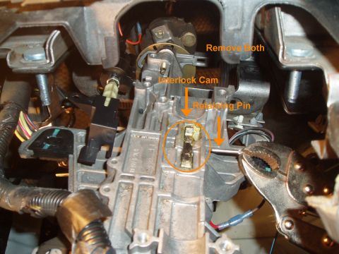 2003 Ford Crown Victoria - This part was the hardest, i started by taking a thick flat head screw driver on the other end of the pin (left side) and bending it at an…